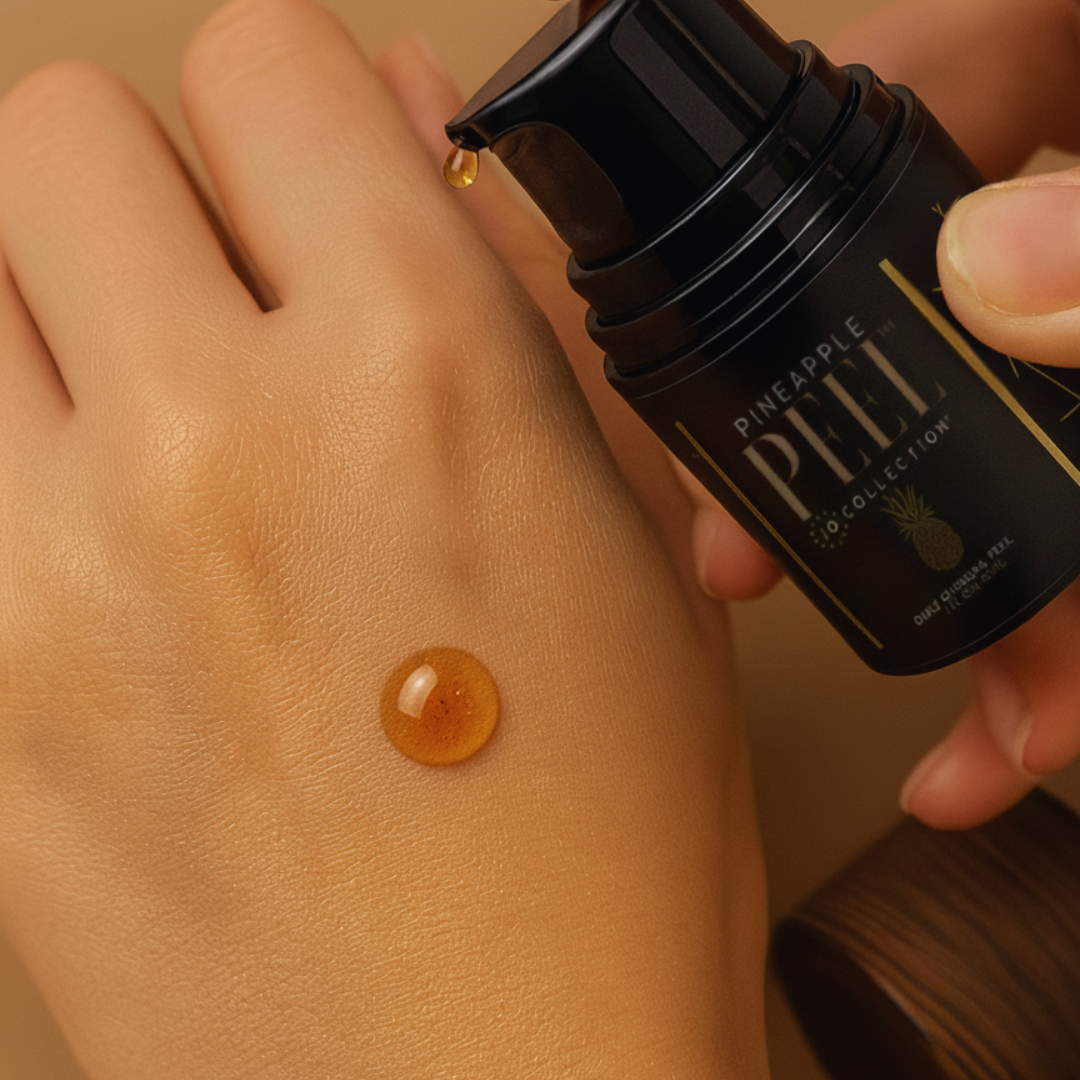 Hand applying a droplet of Pineapple Peel product to skin