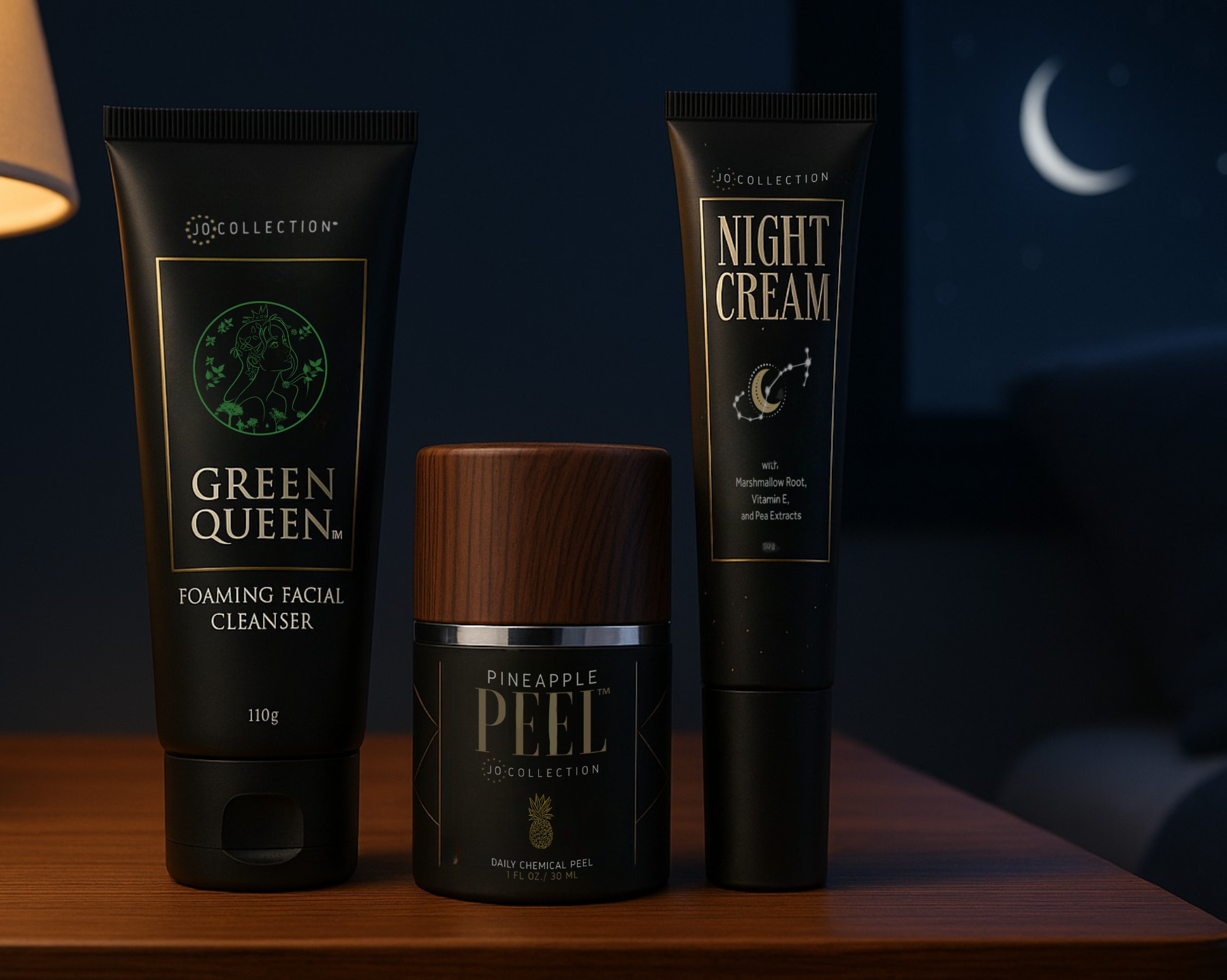 Green Queen Cleanser pineapple peel and Jo Collection Night Cream skincare products on a wooden surface with a dark night background