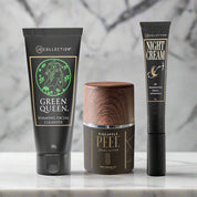 Jo Collections 'Green Queen cleanser' 'Alpha Beta Pineapple Peel' and 'Night cream with marshmallow root" in a row on marble counter