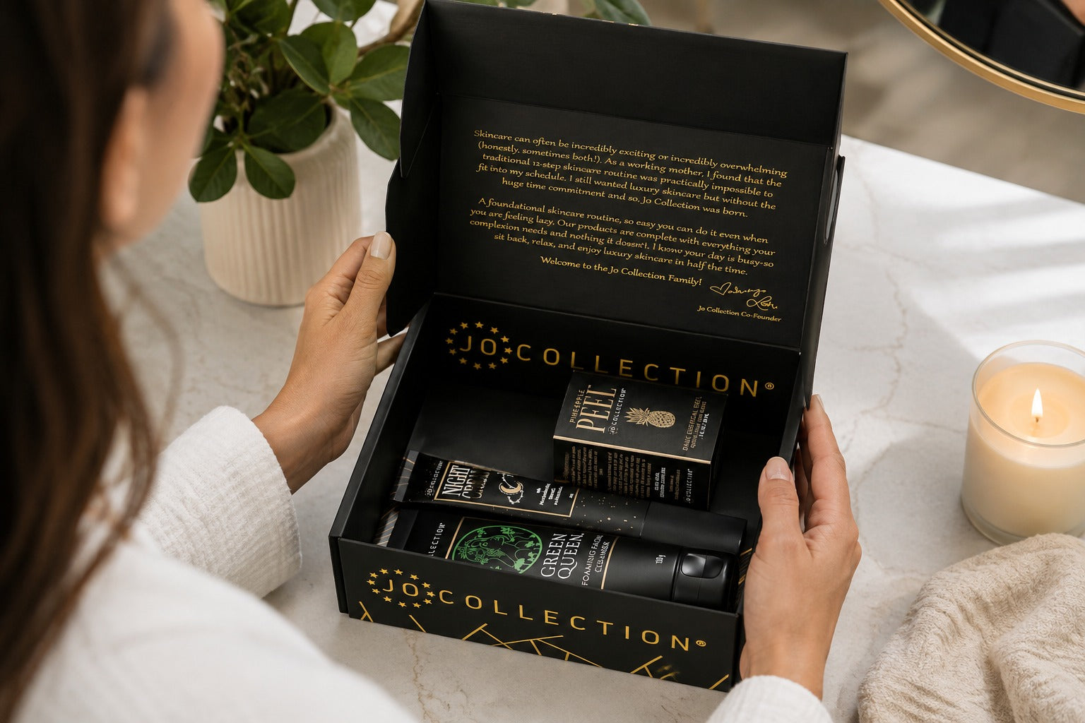 Woman opening the box of Jo collection kit