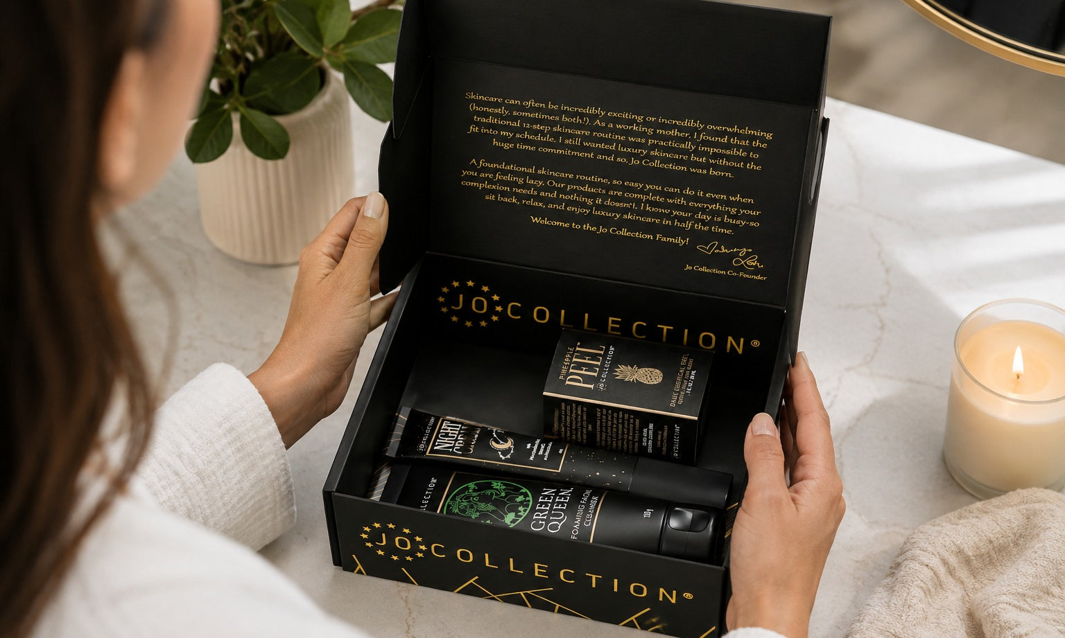 Woman opening the box of Jo collection kit