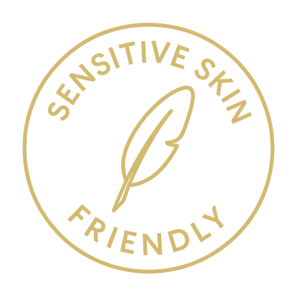 Gold 'Sensitive Skin Friendly' label with a feather on a white background